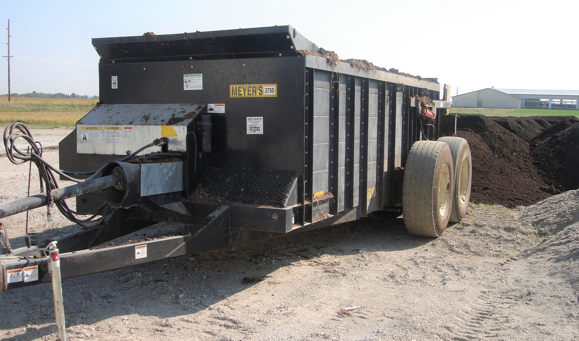 Waggon for placing separation solids in windrows at an Iowa cattle farm. 